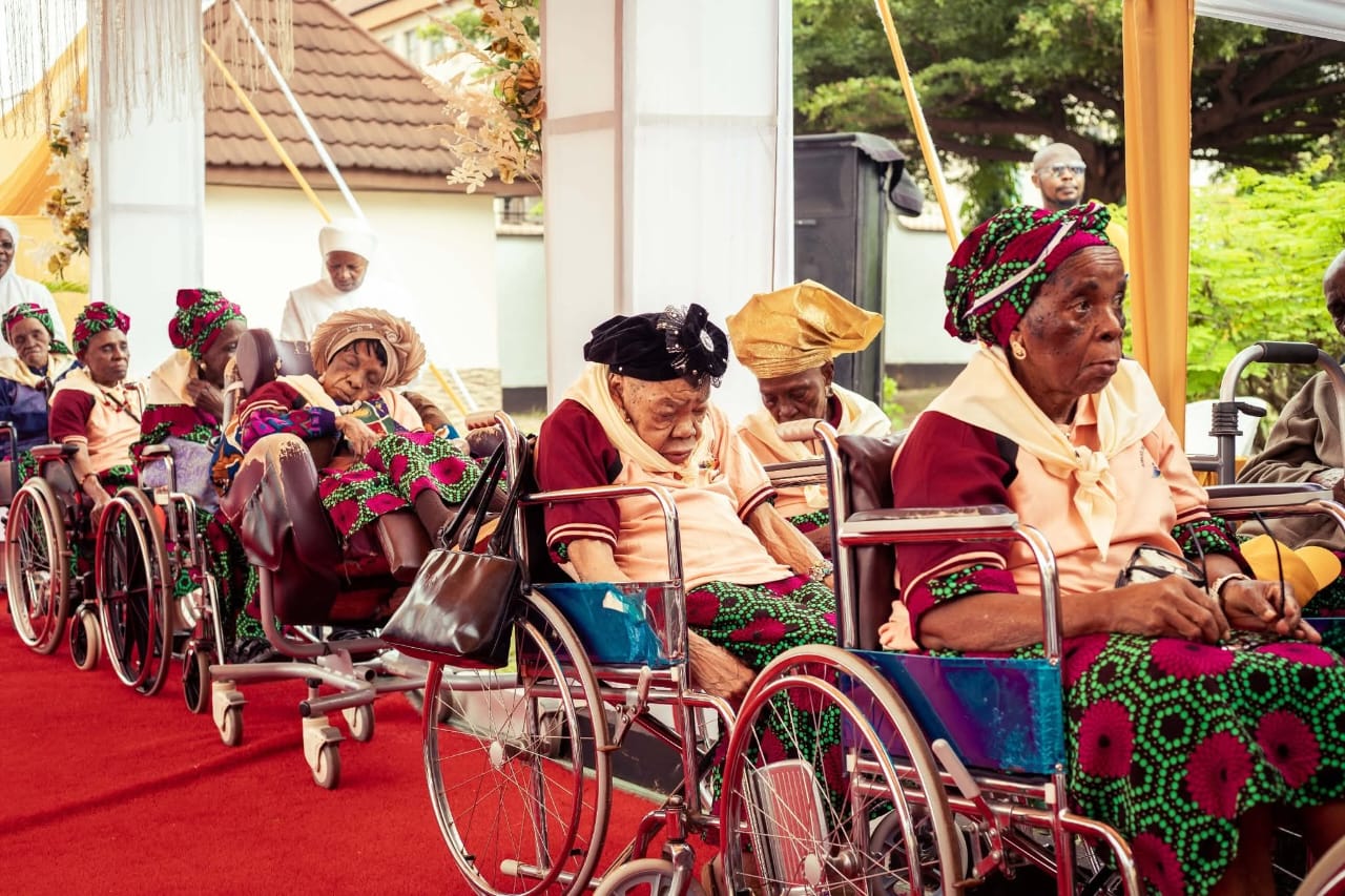 Residents seated together during a Little Sisters community gathering.